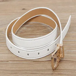 Close-up detail of a minimalist white slim leather belt with a polished gold-tone metal buckle.