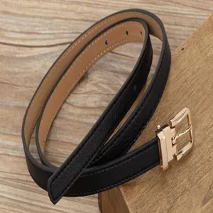 Women's minimalist thin black leather belt with gold pin buckle for casual daily wear.