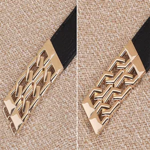 Close-up detail of women thin black belt featuring elegant gold geometric metal buckle design.