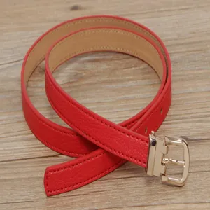 Red leather belt for women with gold pin buckle, stylish thin waist belt for daily wear.