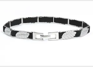 Elegant black elastic waist belt featuring silver metal leaf charms for dress decoration.