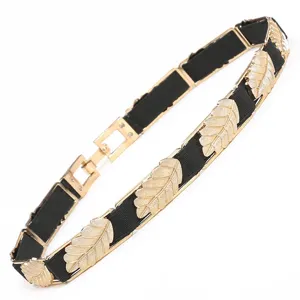 Gold leaf elastic waist belt for women, stylish metal dress accessory and waist cincher.
