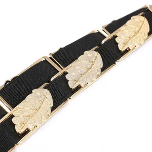 Women fashion elastic waist belt with gold tone metal leaf decor dress accessory.