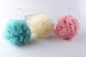 Detailed view of colorful bath sponges, soft mesh loofah with hanging string for daily body care.