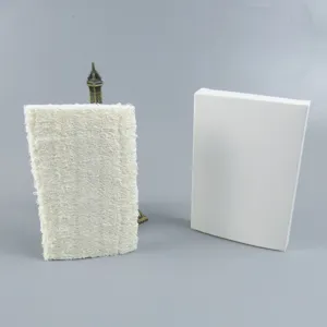 Detail view of natural loofah sponge and white box, eco-friendly bath scrubber, close-up texture