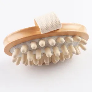 Wooden massage brush detail showing smooth wooden nubs and comfortable fabric hand strap.