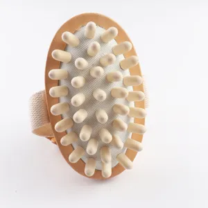 Wooden massage brush with ergonomic handle and wooden nubs for relaxing body spa care.