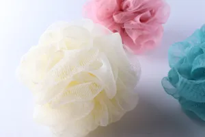 Close-up detail of soft colorful mesh bath sponge, fine PE netting for rich lathering bubble.