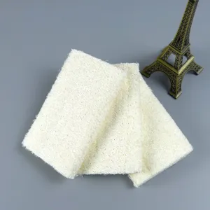 Natural loofah bath sponge scrubber, eco-friendly plant fiber body exfoliating pad detail view.