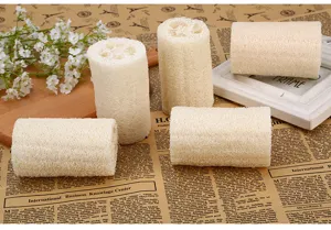 Natural loofah bath sponge detail shot, plant fiber body scrubber for exfoliating and shower use.