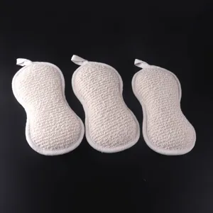 Peanut shaped hemp bath sponge detail view, natural exfoliating body scrubber with hanging loop.