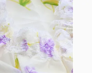 Waterproof shower cap detail, white lace ruffle trim, pale yellow floral fabric texture.