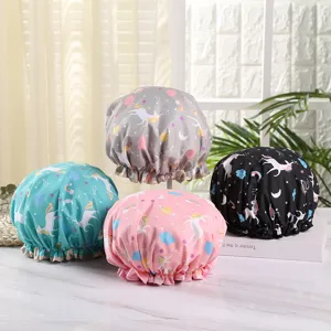 Waterproof shower cap detail showcasing dual-layer cute unicorn print and elastic stretchy band.