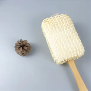 Detailed shot of natural sisal bath brush with wooden handle for exfoliating and body spa care.