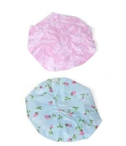 Detail view of waterproof shower cap featuring floral patterns, ideal for bathing and hair care.