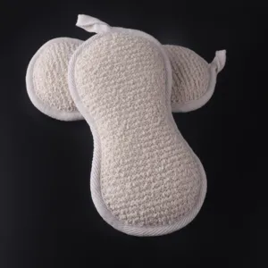 Natural exfoliating bath sponge, peanut shaped body scrubber with loop for home shower use.