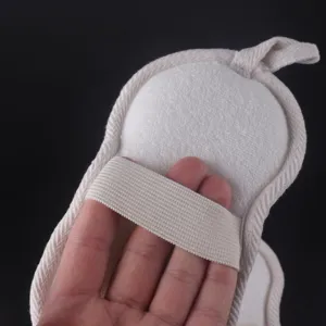 Handheld bath sponge scrubber with elastic strap for comfortable body exfoliating and cleaning.