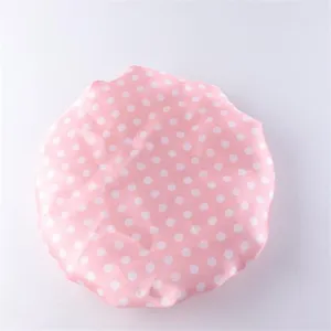 Dettaglio cuffia doccia pois rosa, cuffia per la cura dei capelli impermeabile a doppio strato.