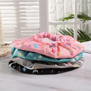 Waterproof double-layer shower cap with cute cartoon prints, elastic lace edge for home use.