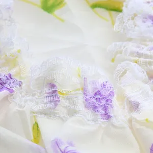 Waterproof shower cap for women, reusable bath hair cap with elegant white lace trim design.