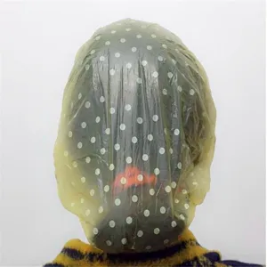 Disposable waterproof shower cap, cute yellow polka dot bath cap for hair and travel use.