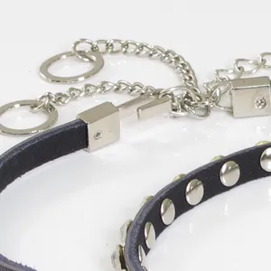 Women fashion black leather thin waist chain belt with metal studs and sparkling rhinestones.