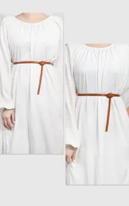 Thin brown leather belt detail close up, elegant waist accessory for women dresses coats.