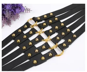 Black leather harness waist belt with metal rings and studs for women dress fashion.
