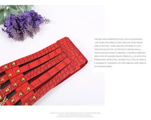 Red wide corset waist belt for women, retro PU leather elastic dress accessory with rivets.