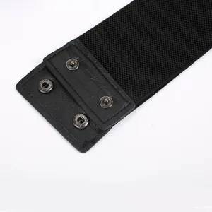 Black wide elastic waist belt with faux leather snap button closure for women fashion dresses.