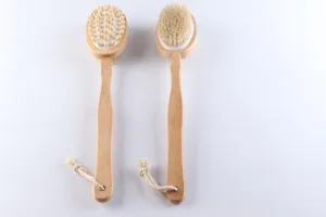 Detail view of wooden long-handled bath brush with natural bristles and massage nodes.