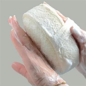 Natural plant fiber loofah bath sponge detail showing soft texture and rich foaming.