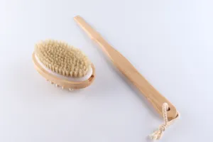 Wooden bath brush with natural bristles, long handle and massage nodes for body exfoliating.