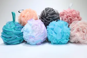 Detailed view of colorful mesh bath sponges, soft PE material for daily body cleaning and shower.