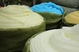 Wholesale colorful mesh bath sponge bulk supply, soft PE material for daily shower body scrubbing.