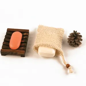 Eco-friendly soap set with wooden draining soap dish and natural sisal foaming net bag for daily use.