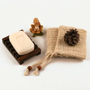 Detailed view of eco-friendly sisal soap bag and wooden draining soap dish set for daily use.