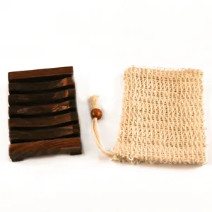 Wooden soap dish and natural fiber foaming bag detail view for bathroom storage and cleaning.