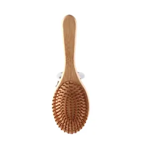 Spazzola per capelli in bambù naturale con cuscino e perni per massaggio del cuoio capelluto.