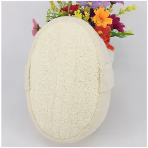 Natural plant fiber loofah bath sponge exfoliation scrubber with hand strap for body care.