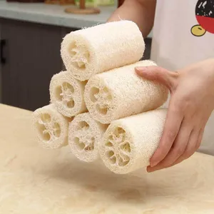 Natural loofah sponge close-up, eco-friendly plant fiber scrubber for kitchen cleaning.