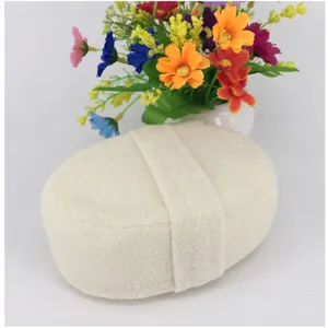 Natural loofah bath sponge exfoliating body scrubber with hand strap for daily shower care.