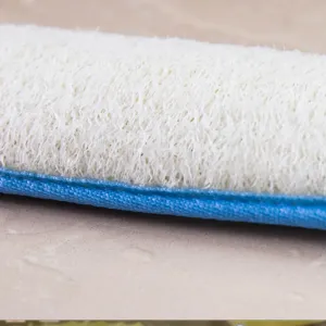 Natural plant fiber loofah bath scrubber detail shot with blue edge for daily body exfoliating care.
