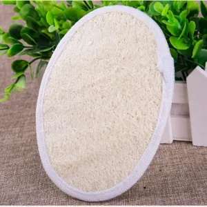 Natural loofah bath sponge oval body scrubber exfoliating scrubber with white cloth border.