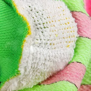 Thick exfoliating bath glove fabric detail texture close up view for daily body cleaning use