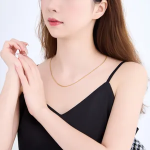 Elegant simple thin gold chain necklace for women, delicate metal neck accessory.