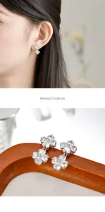 Exquisite zircon flower earrings close-up, featuring sparkling stones and copper alloy build.