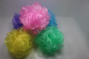 Colorful mesh shower sponge detail view, soft exfoliating bath ball set for daily body care.
