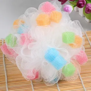 Detailed view of colorful bath sponge with soft mesh net and inner sponge balls for body cleaning.