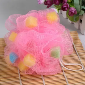 Large pink mesh bath sponge with colorful foam pieces, soft shower puff for daily body cleaning.